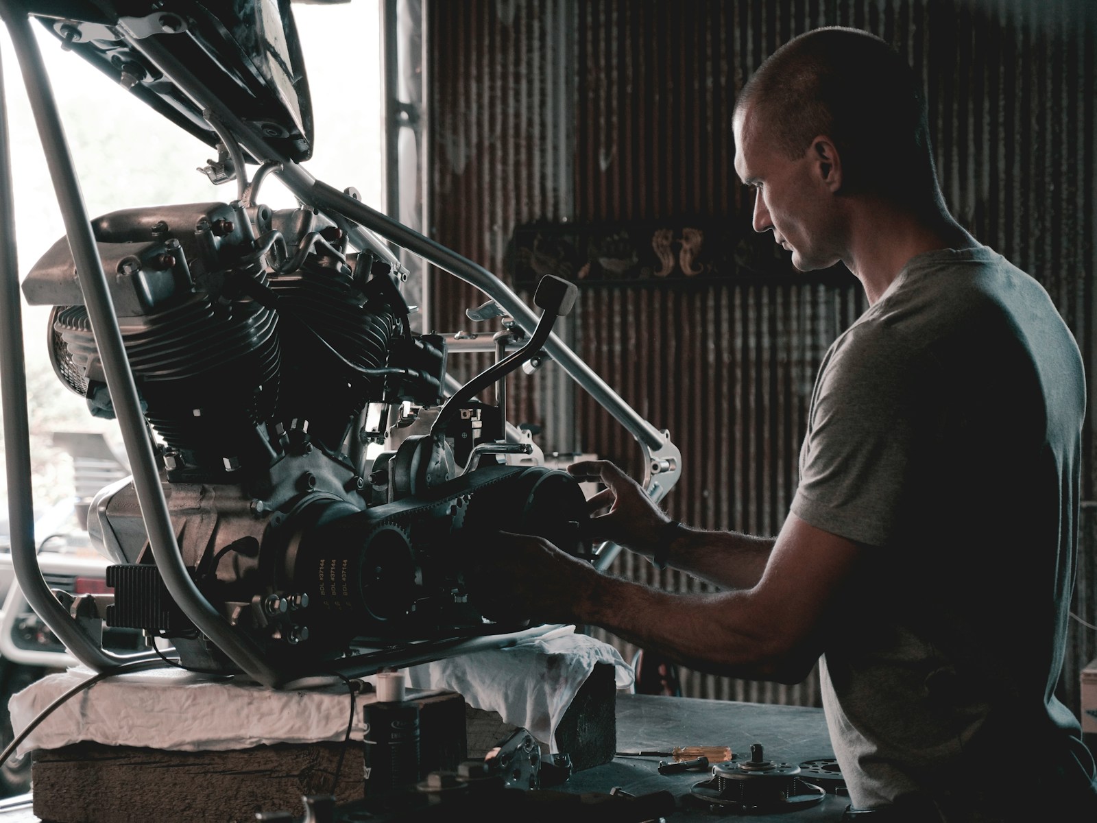 Christian Klein, founder of Unlimited Auto, meticulously works on a motorcycle engine in his Weiden master workshop.